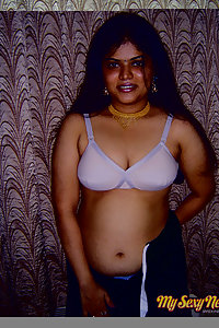 Gorgeous Neha Nair in white bra giving seductive poses