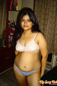 Gorgeous Neha Nair in white bra giving seductive poses