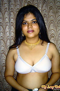 Gorgeous Neha Nair in white bra giving seductive poses