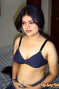 Sexy neha nair in bedroom showing her assets off