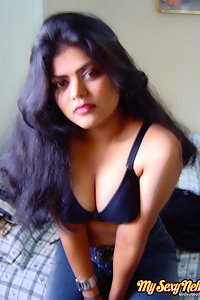 Sexy neha nair in bedroom showing her assets off