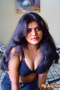 Sexy neha nair in bedroom showing her assets off