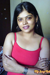 Indian Wife Neha in her bedroom showing her juicy boobs