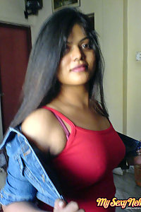 Indian Wife Neha in her bedroom showing her juicy boobs