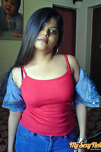 Indian Wife Neha in her bedroom showing her juicy boobs