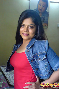 Indian Wife Neha in her bedroom showing her juicy boobs