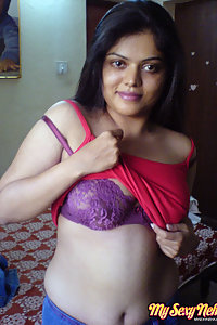 Indian Wife Neha in her bedroom showing her juicy boobs