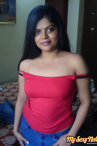 Indian Wife Neha in her bedroom showing her juicy boobs