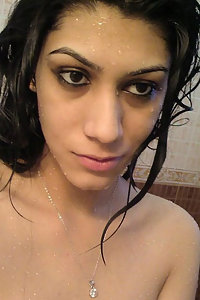horny Indian girl rubbing her pussy in shower