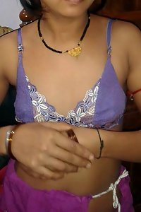 Amateur Indian wife opening her blouse to show off boobs