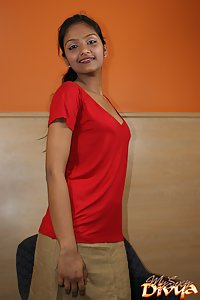 Divya in red top and brown skirt teasing her fan licking oranges