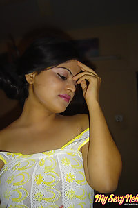 Indian Wife Neha showing off her big boobs in yellow camisole