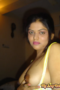 Indian Wife Neha showing off her big boobs in yellow camisole