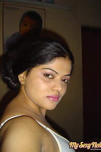 Indian Wife Neha showing off her big boobs in yellow camisole