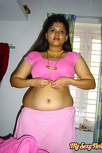 Delicious Neha stripping her pink saree off showing pussy