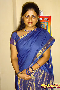 Hot and sexy Neha Nair in blue south Indian sari