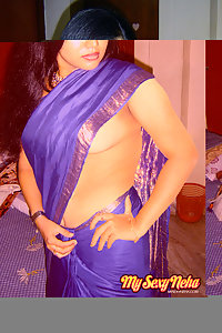 Hot and sexy Neha Nair in blue south Indian sari