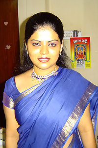 Hot and sexy Neha Nair in blue south Indian sari