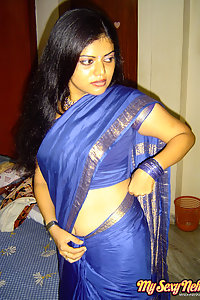 Hot and sexy Neha Nair in blue south Indian sari