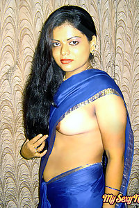 Hot and sexy Neha Nair in blue south Indian sari