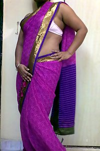 Indian homemaker stripping her traditional Indian outfits